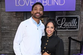 Lydia Velez in a black dress posing at SXSW with Milton Johnson, who is wearing a white button up
