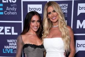 Kim Zolciak, in a white dress, posing with Ariana Biermann, in a grey dress, while backstage at Watch What Happens Live
