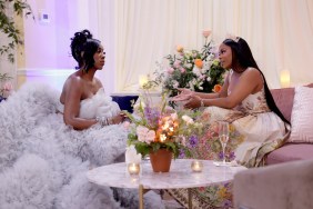 Keiarna Stewart and Wendy Osefo sitting across from each other at the Second Bloom Ball on Real Housewives of Potomac