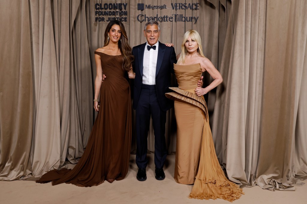The Clooneys with Donatella Versace