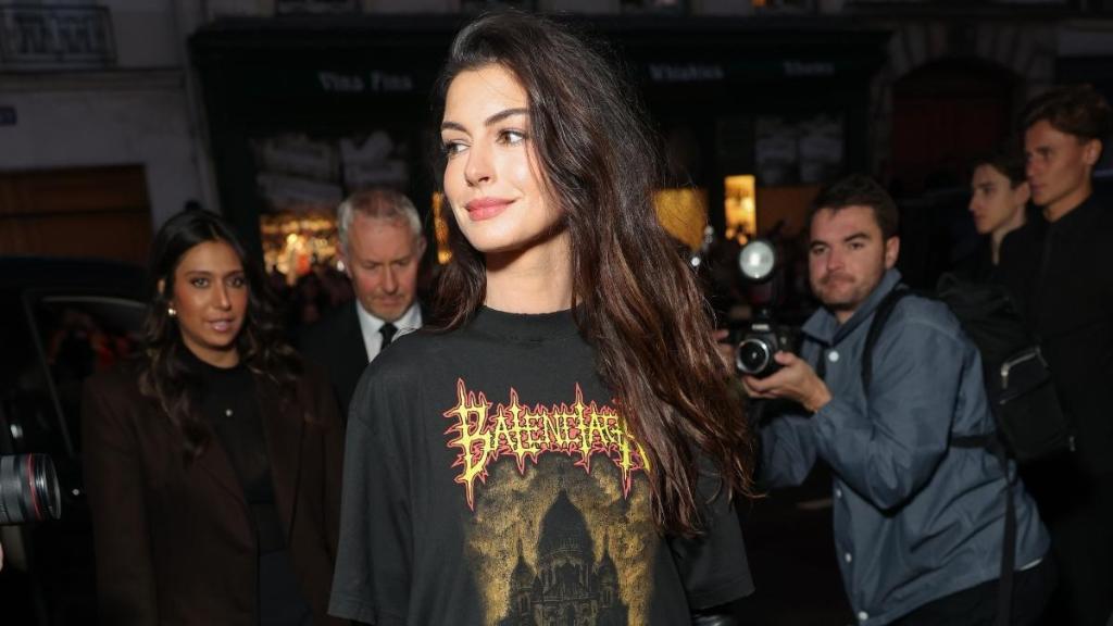 Anne Hathaway’s Graphic Floor-Length Tee Look in Paris Video Is ‘Rock-Chic Perfection'
