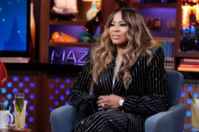 Mary Cosby in a black pinstripe suit making a disgusted face on Watch What Happens Live