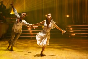 VALENTIN CHMERKOVSKIY and ALIX EARLE dancing in yellow light on Dancing with the Stars week 5