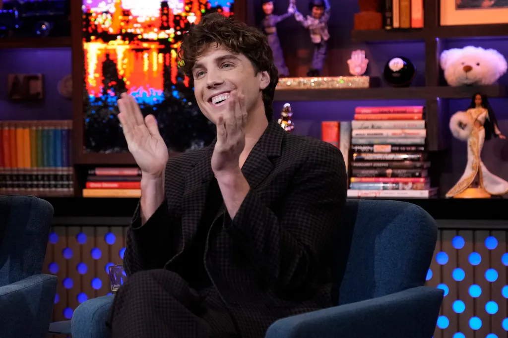 Lukas Gage on Watch What Happens Live clapping his hands