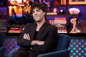 Lukas Gage with his arms crossed sitting on Watch What Happens Live