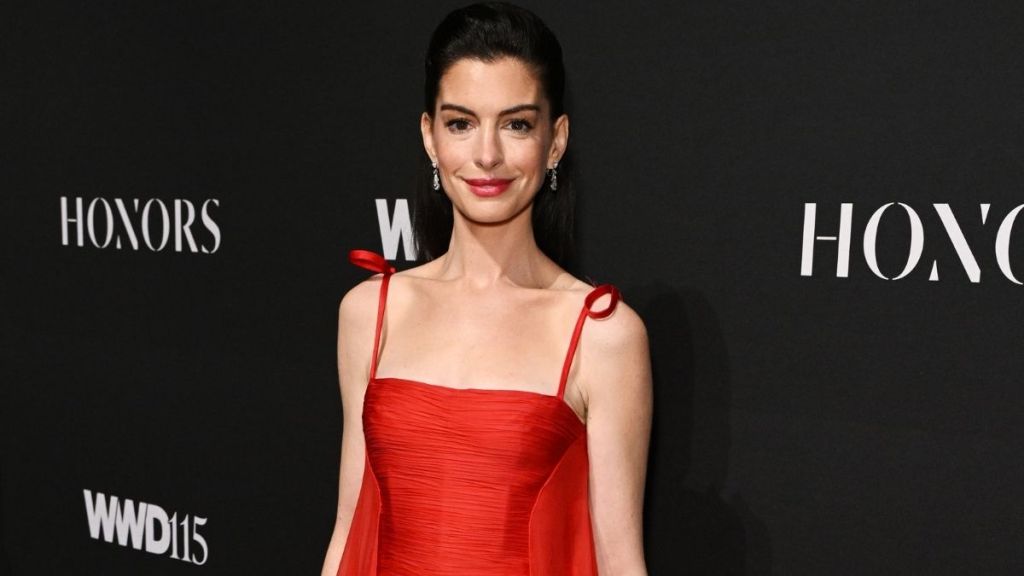 Anne Hathaway Sets Fire to 2025 WWD Honors Carpet in Red Gown