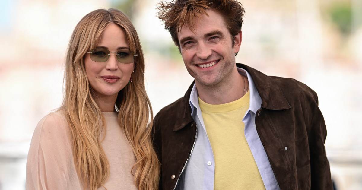 Jennifer Lawrence and Robert Pattinson laughing together