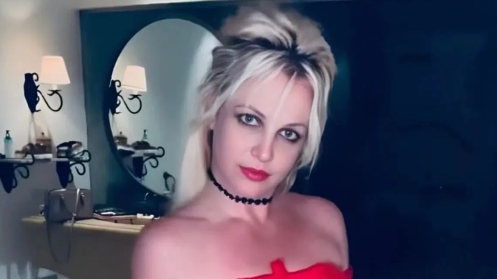 Britney Spears Twirls in Pink Mini-Dress With Daring Neckline