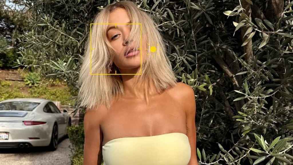 Rita Ora Sports Vibrant Yellow Bandeau & Chiseled Abs