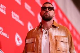 Travis Kelce Pulled Up in Showgirl Orange Look Ahead of Chiefs Game