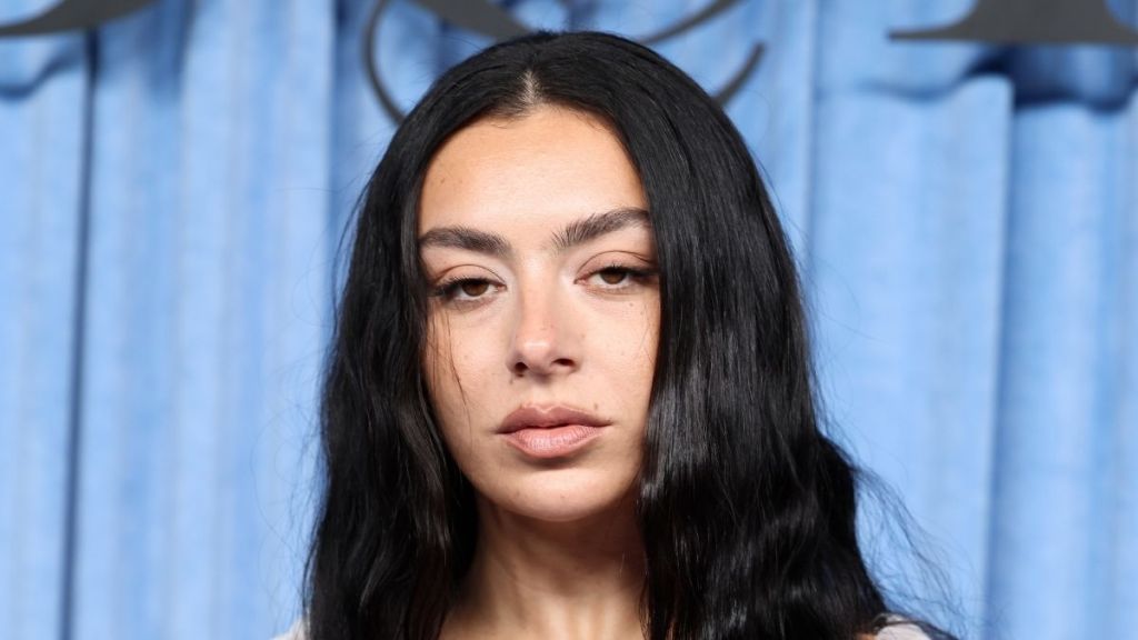 Charli XCX Stuns in Sheer Black Off-Shoulder Outfit, Fans Say 'Height of Glamor'