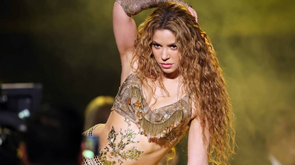 Photos of Shakira Posing While She Tattoos a Model's Back Need to Be Seen