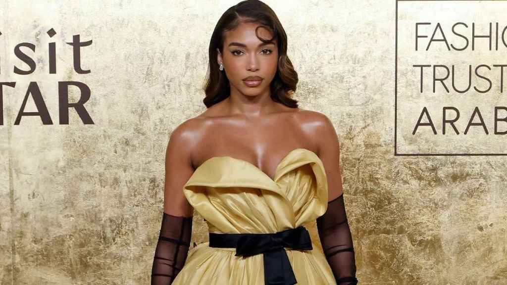 Lori Harvey's Poses Make Her Thigh-High Slit Dress Pop Out