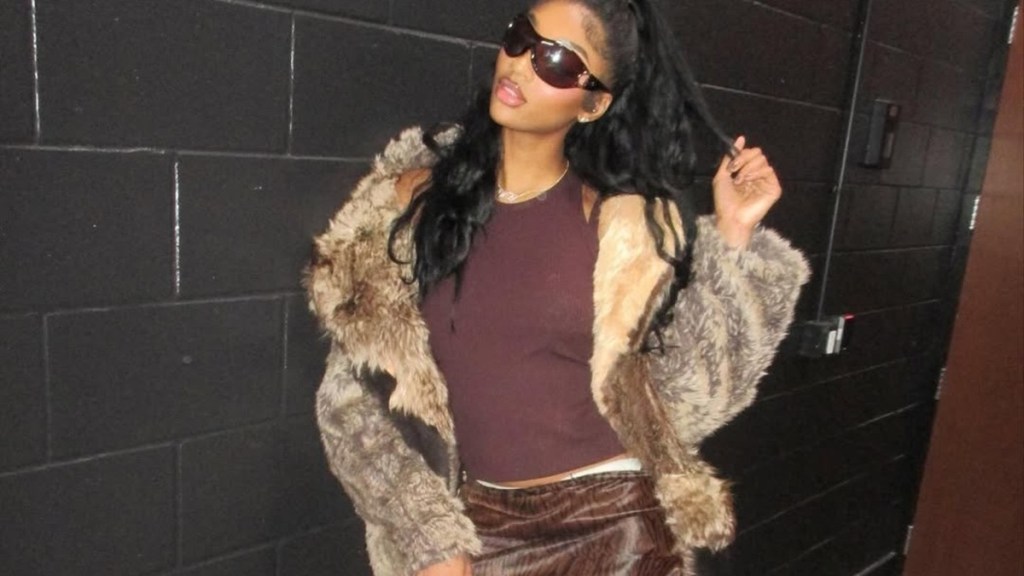 Angel Reese Turns Heads in Fur Coat & Mini-Skirt