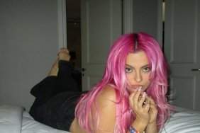 Bebe Rexha Poses in Just Jeans on Her Bed