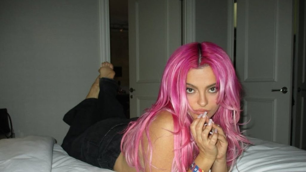 Bebe Rexha Poses in Just Jeans on Her Bed