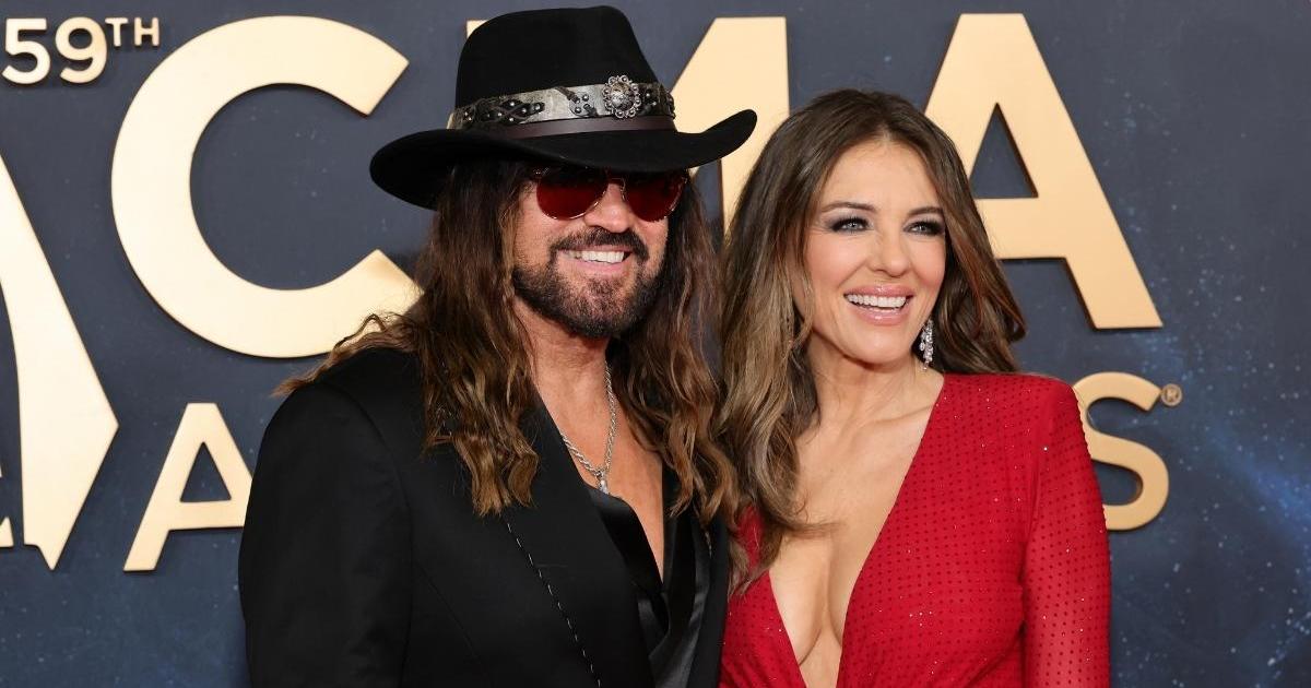 Elizabeth Hurley & Billy Ray Cyrus Get Cuddly on CMA Awards Red Carpet