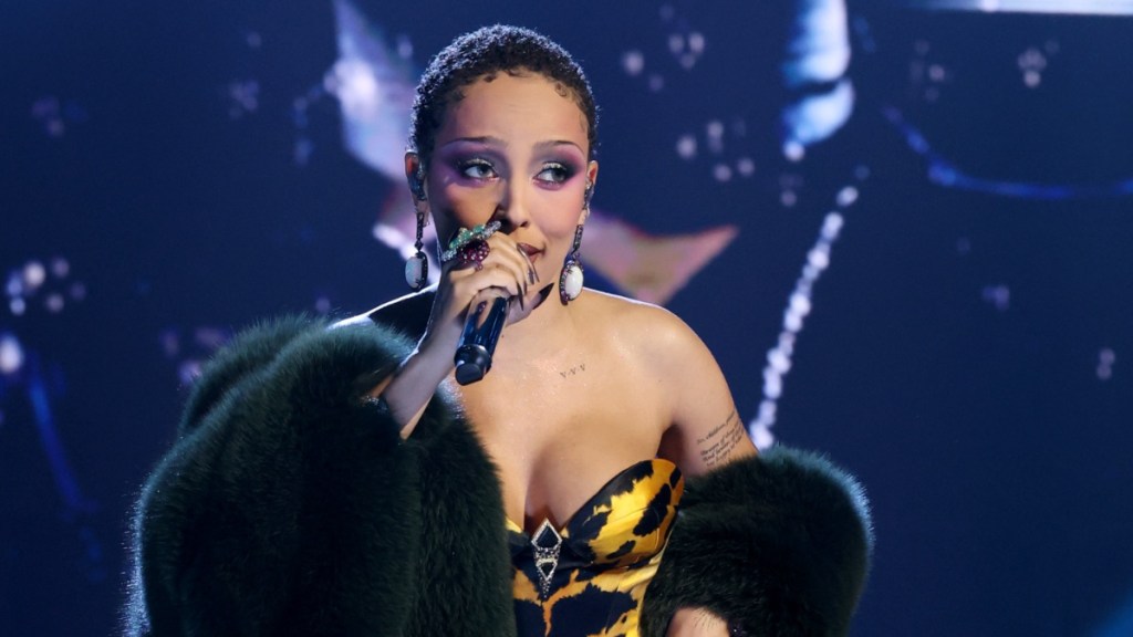 Doja Cat Turns Heads in Bodysuit & Fishnet Stocking