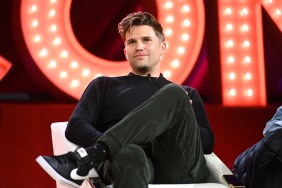 Tom Schwartz sitting with his legs crossed on stage at BravoCon