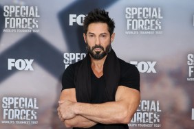 Rudy Reyes in a black shirt posing with his arms crossed at the Special Forces premiere