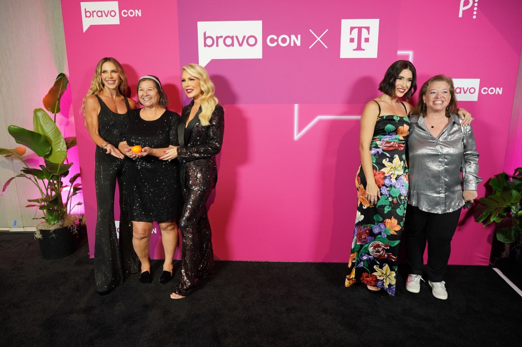 Gretchen Rossi and Jennifer Pedranti posing with fans, while Bronwyn Newport poses with a fans several feet away