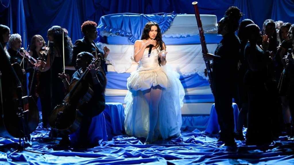 Rosalia Makes a Statement in Strapless Bustier Top & Miniskirt