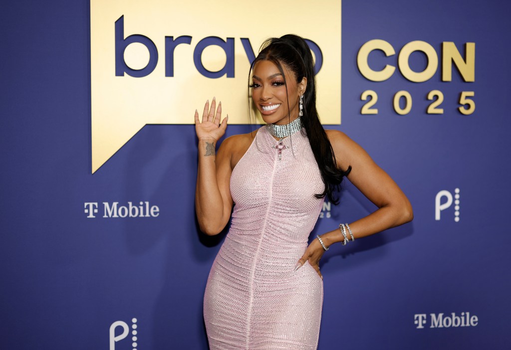 Porsha Williams on the BravoCon red carpet waving to the camera