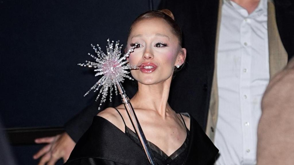 Ariana Grande Pays Homage to Original Glinda in Lace Outfit