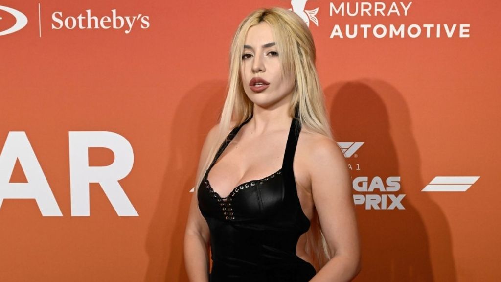 Ava Max's Snug Black Dress Photo Features Flirty Tie-up Detail