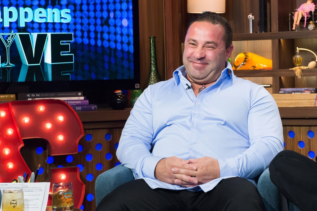 Joe Giudice in a blue shirt on Watch What Happens Live
