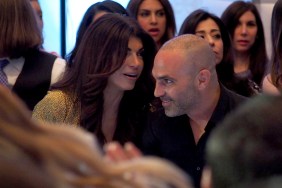 Teresa Giudice and Joe Gorga talking to each other, sitting in the audience of Melissa Gorga's fashion show