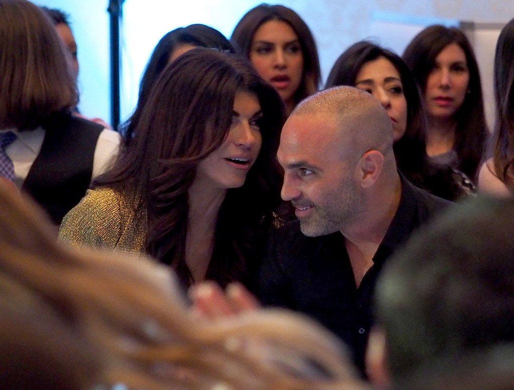 Teresa Giudice and Joe Gorga talking to each other, sitting in the audience of Melissa Gorga's fashion show