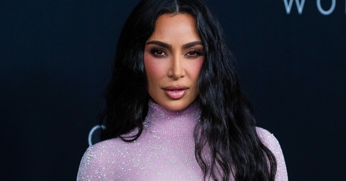 Kim Kardashian Looks Like Bond Girl in Sheer Purple Outfit