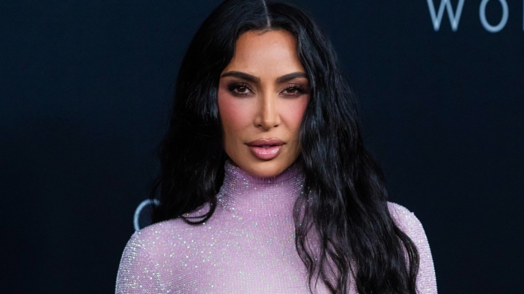 Kim Kardashian Looks Like Bond Girl in Sheer Purple Outfit