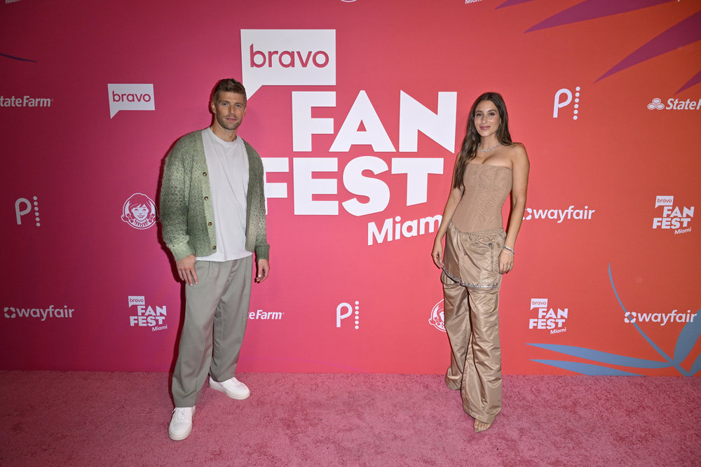 Kyle Cooke and Amanda Batula standing several feet away from each other at Bravo Fan Fest Miami