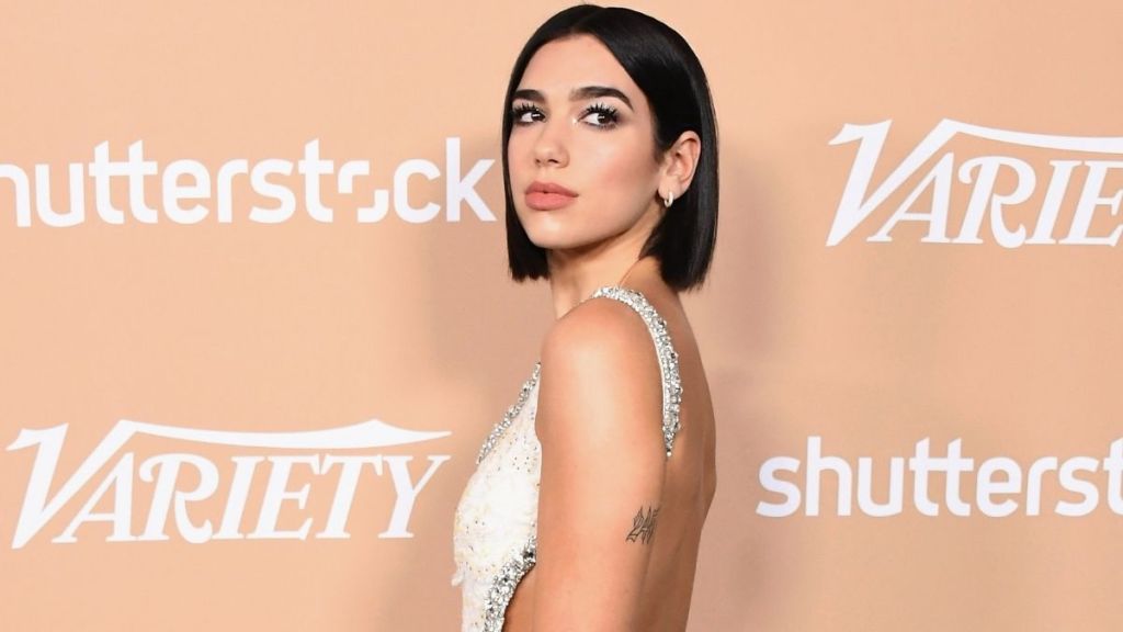 Dua Lipa Poses in Backless Top & It's Everything