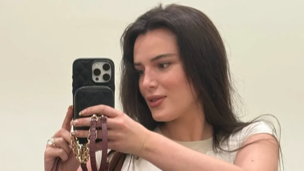 Bella Thorne Posing in Crop-Top Comes With Furry Surprise