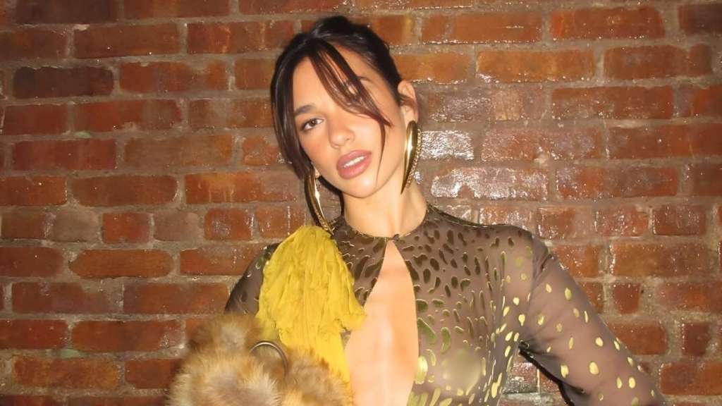 Dua Lipa Trades Gucci Look for Fully Sheer Top With Massive Cutout
