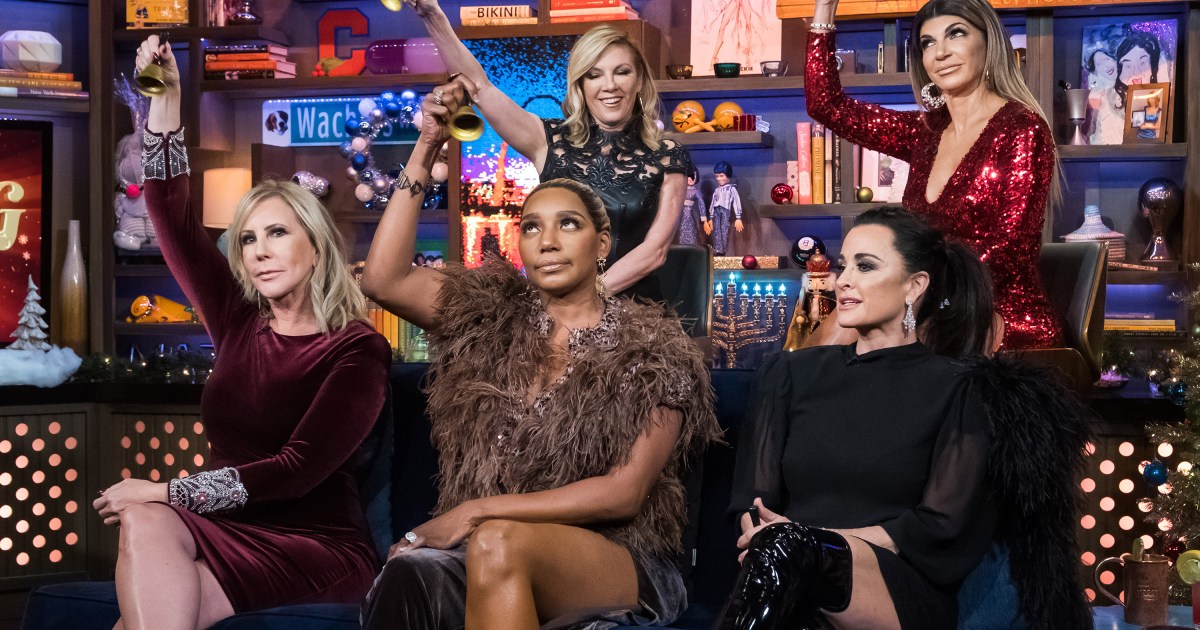 Vicki Gunvalson, NeNe Leakes, Ramona Singer, Kyle Richards and Teresa Giudice on Watch What Happens Live, holding up bells in their hands