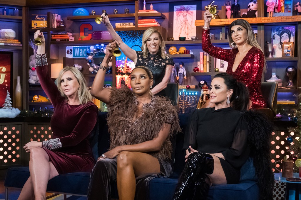 Vicki Gunvalson, NeNe Leakes, Ramona Singer, Kyle Richards and Teresa Giudice on Watch What Happens Live, holding up bells in their hands