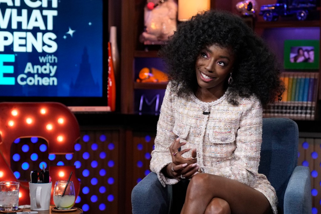 Venita Aspen on Watch What Happens Live, smiling and looking up