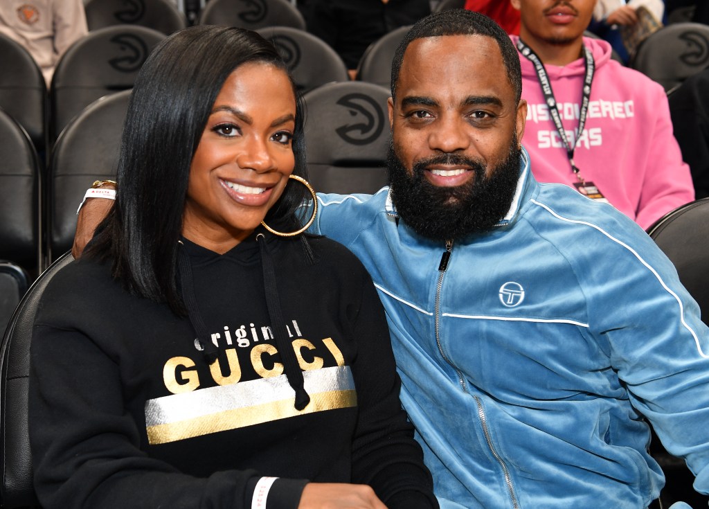 Kandi Burruss and Todd Tucker sitting courtside at an Atlanta Hawks game