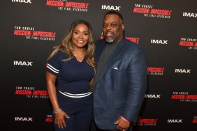 Dr. Damon Kimes and Dr. Heavenly Kimes at a red carpet event, both dressed in navy blue