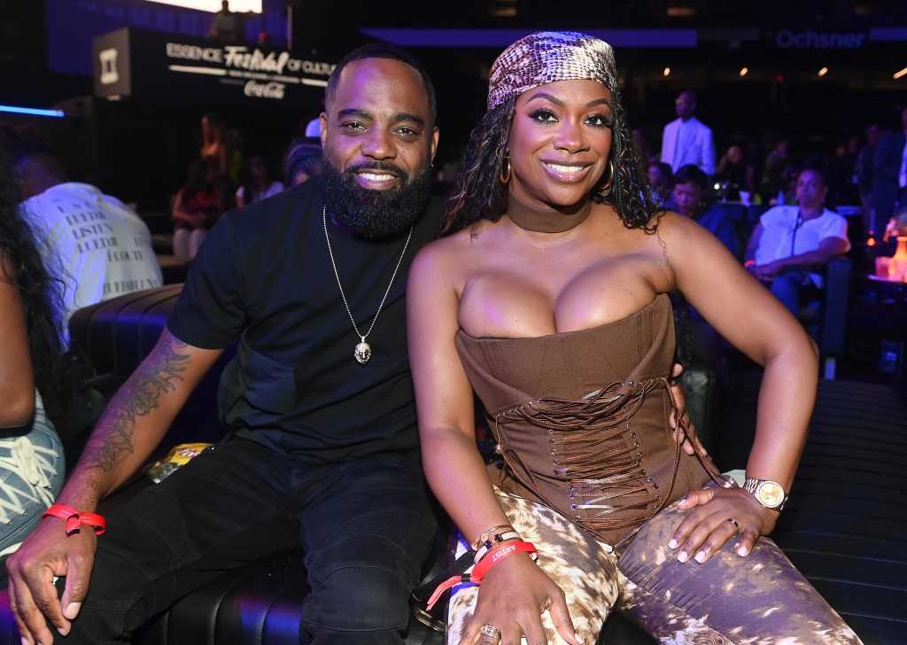 Todd Tucker and Kandi Burruss sitting in the crowd at the 2025 Essence Festival