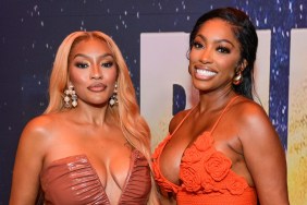 Drew Sidora and Porsha Williams posing together at the premiere of Run
