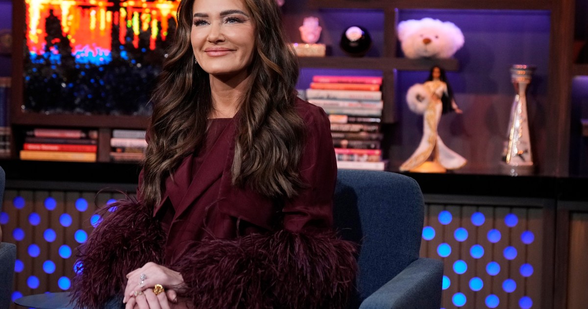 Meredith Marks in a red dress on Watch What Happens Live