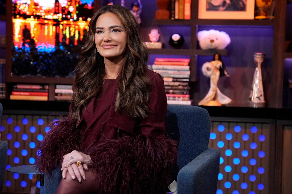 Meredith Marks in a red dress on Watch What Happens Live