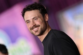 Dylan Efron in a black sweater posing at the premiere of Zootopia 2