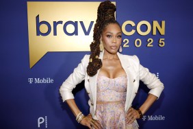 Monique Samuels at BravoCon 2025 in a pink dress posing with her hands on her hips