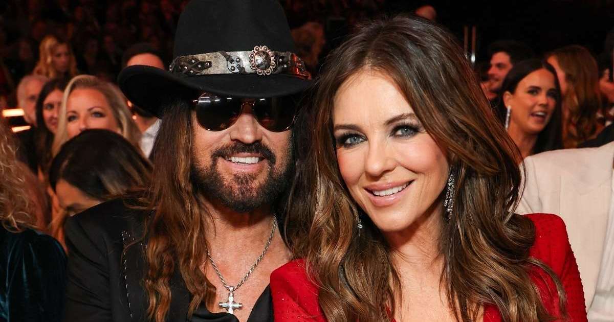 Elizabeth Hurley Cuddles Billy Ray Cyrus in Fully Sheer…